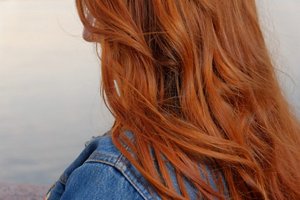 Woman with wavy strawberry blonde hair